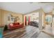 Open-concept living and dining area with wood-like floors, and abundant natural light at 1410 Halapa Way, Trinity, FL 34655