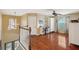Upstairs loft area featuring beautiful hardwood floors and a ceiling fan for comfort at 1410 Halapa Way, Trinity, FL 34655