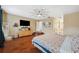 Bright main bedroom featuring hardwood floors, recessed ceiling, and ample space at 1410 Halapa Way, Trinity, FL 34655