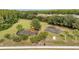 Aerial view of community playground featuring slides, climbing structures, and mature trees at 1410 Halapa Way, Trinity, FL 34655