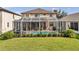 Inviting screened-in pool and patio area, perfect for outdoor relaxation at 1410 Halapa Way, Trinity, FL 34655