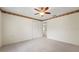 Bedroom featuring a ceiling fan and a window that provides natural light and views of the outdoors at 1415 Pinewood Hills Ct, Spring Hill, FL 34606
