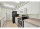 Modern kitchen featuring stainless steel oven and microwave at 1415 Pinewood Hills Ct, Spring Hill, FL 34606