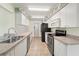 Bright kitchen with updated appliances and ample counter space at 1415 Pinewood Hills Ct, Spring Hill, FL 34606
