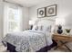 Inviting bedroom with a plush bed, bedside tables, and ample natural light at 175 Voltaire Dr, Spring Hill, FL 34609