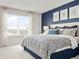 Serene primary bedroom with a large window and a relaxing color scheme at 175 Voltaire Dr, Spring Hill, FL 34609