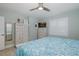 Bright bedroom with a ceiling fan and light-colored furniture at 1830 Santa Barbara Dr, Dunedin, FL 34698