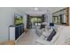 Cozy living room with comfortable seating, television, and view of the lanai at 1830 Santa Barbara Dr, Dunedin, FL 34698