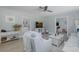 Bright living room with an open floor plan, comfortable seating, and stylish decor at 1830 Santa Barbara Dr, Dunedin, FL 34698