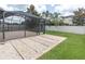 Landscaped backyard features a screened-in patio and gravel area at 19326 Long Lake Ranch Blvd, Lutz, FL 33558