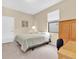Neutral bedroom featuring a bed, study area, and a window providing natural light at 19326 Long Lake Ranch Blvd, Lutz, FL 33558