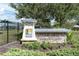 Long Lake Ranch community entrance sign, stone base, and landscaping at 19326 Long Lake Ranch Blvd, Lutz, FL 33558
