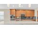Spacious kitchen with granite counters, stainless appliances, and pendant lighting at 19326 Long Lake Ranch Blvd, Lutz, FL 33558