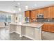 Modern kitchen featuring granite countertops, stainless steel appliances, and a large island with seating at 19326 Long Lake Ranch Blvd, Lutz, FL 33558
