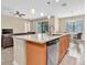 Open kitchen with granite countertops, stainless steel appliances, and a view of the living area at 19326 Long Lake Ranch Blvd, Lutz, FL 33558