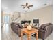 Warm and inviting living room with a piano, comfortable seating, and stylish décor at 19326 Long Lake Ranch Blvd, Lutz, FL 33558