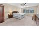 Tranquil main bedroom with a ceiling fan, natural light, and neutral décor at 19326 Long Lake Ranch Blvd, Lutz, FL 33558