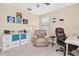 Home office featuring a comfortable recliner, bright decor, and ample natural light at 19326 Long Lake Ranch Blvd, Lutz, FL 33558