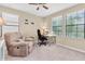 Bright office with neutral carpet, a recliner, and a desk near the window at 19326 Long Lake Ranch Blvd, Lutz, FL 33558