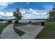 Community picnic area with barbecue grills and scenic lake view, ideal for outdoor gatherings at 19326 Long Lake Ranch Blvd, Lutz, FL 33558