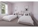 Charming bedroom with twin beds, playful artwork, and bright natural light at 20021 Golden Glow Loop, Venice, FL 34292
