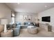 Comfortable living room with a large sectional sofa, TV, and stylish decor for relaxation at 20021 Golden Glow Loop, Venice, FL 34292