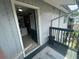 Balcony view into a kitchen, showing outdoor space with rails and building exterior at 203 Pine Violet Ct # 202, Tampa, FL 33612