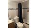 Bathroom featuring a shower and tub with white tile and decorative blue tile at 203 Pine Violet Ct # 202, Tampa, FL 33612