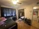 Bedroom featuring dark curtains, a closet and full size bed with unique floors at 203 Pine Violet Ct # 202, Tampa, FL 33612