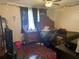 Bedroom with a ceiling fan, window with curtains, and a full size bed at 203 Pine Violet Ct # 202, Tampa, FL 33612