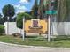Renaissance Condominiums street sign provides directions in a lush, landscaped setting at 203 Pine Violet Ct # 202, Tampa, FL 33612