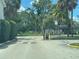 Gated community entrance with manicured landscaping offering security and privacy at 203 Pine Violet Ct # 202, Tampa, FL 33612