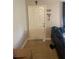 Bright entryway with a white door and tile flooring, creating a welcoming space at 203 Pine Violet Ct # 202, Tampa, FL 33612