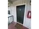 A close up shot of a condo door with the unit number and a fire extinguisher at 203 Pine Violet Ct # 202, Tampa, FL 33612