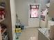 Functional kitchen area showcasing a pantry with open shelving and white door at 203 Pine Violet Ct # 202, Tampa, FL 33612