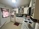 Functional kitchen with essential appliances, white cabinets, and granite countertops at 203 Pine Violet Ct # 202, Tampa, FL 33612
