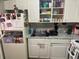 Practical kitchen with essential appliances, white cabinets, and granite countertops at 203 Pine Violet Ct # 202, Tampa, FL 33612