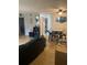 Cozy living room with tile floors, ceiling fan, and dining area for entertaining at 203 Pine Violet Ct # 202, Tampa, FL 33612