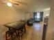 Inviting living room with tile flooring, a dining area and access to more rooms at 203 Pine Violet Ct # 202, Tampa, FL 33612