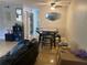 Inviting living space with a ceiling fan, tile flooring and dining table with seating at 203 Pine Violet Ct # 202, Tampa, FL 33612