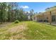 Expansive backyard featuring a covered patio and green surroundings at 27295 Tarbel Rd, Brooksville, FL 34602