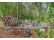 The backyard includes a seating area with a firepit and plenty of firewood at 27295 Tarbel Rd, Brooksville, FL 34602