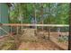 A fenced area is in the backyard and is covered with organic material at 27295 Tarbel Rd, Brooksville, FL 34602
