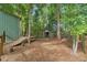 The backyard includes an outbuilding, small ramp and several cut logs at 27295 Tarbel Rd, Brooksville, FL 34602