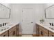 Stylish bathroom boasts dual sinks with quartz countertops and modern fixtures at 27295 Tarbel Rd, Brooksville, FL 34602