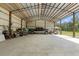 Vast outbuilding with vehicles parked inside, offering versatile usage at 27295 Tarbel Rd, Brooksville, FL 34602