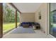 Covered outdoor patio, with comfortable seating and views of the lawn at 27295 Tarbel Rd, Brooksville, FL 34602