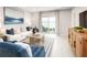 Cozy living room with stylish furniture and a view of the lake at 288 Voltaire Dr, Spring Hill, FL 34609