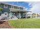 Large backyard with patio and waterfront views at 3150 Trident Ter, New Port Richey, FL 34652