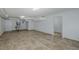 Finished basement with tile flooring, bright recessed lighting and ample potential at 3150 Trident Ter, New Port Richey, FL 34652